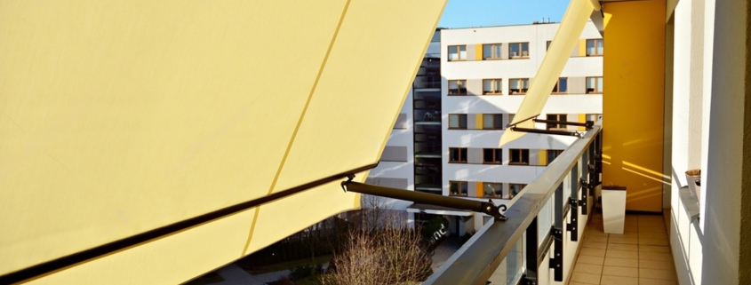 modern architecture building facade with convertible awnings balcony with convertible awning opened covered by sun shield convertibel awnings